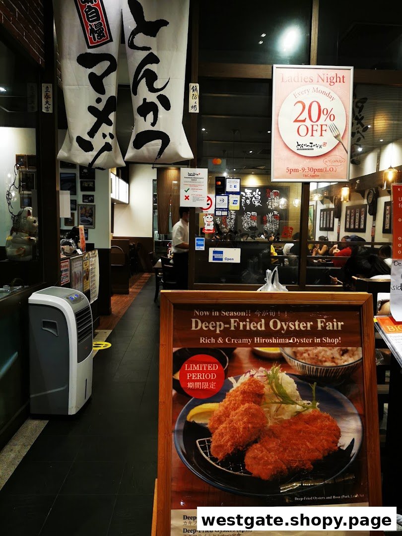 The entrance of Tonkatsu by Ma Maison, featuring promotional displays and a glimpse of the inviting interior.