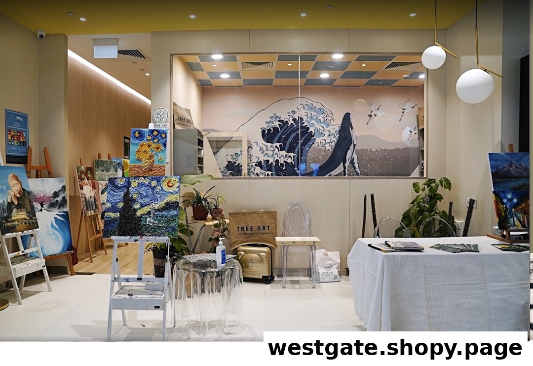 An inviting interior of Tree Art studio, showcasing various paintings on easels and a creative atmosphere.