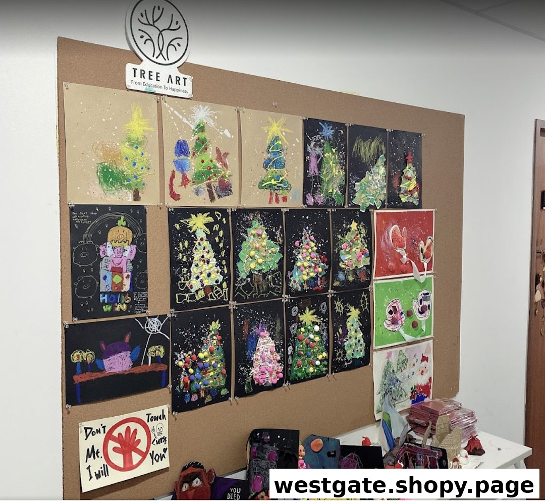 A vibrant display of children's Christmas-themed artwork and crafts on a cork board at Tree Art.