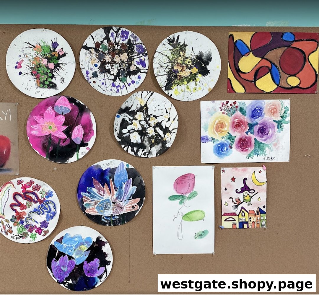 A vibrant display of diverse student artworks, including paintings and mixed media pieces, on a brown corkboard.