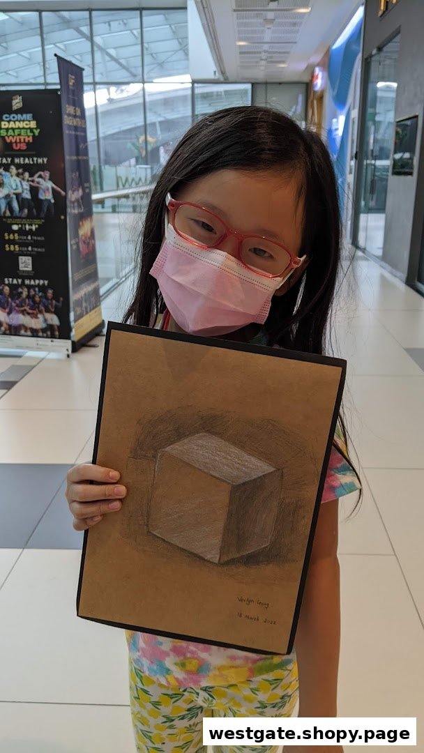 A young student proudly displays their impressive 3D cube artwork, showcasing their artistic talent.