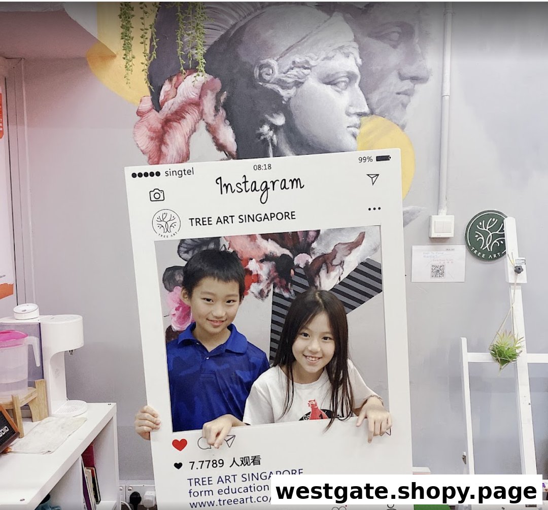 Two smiling children pose with an Instagram frame inside the vibrant Tree Art studio, featuring a classical mural.