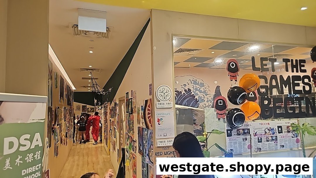 A vibrant hallway adorned with children's artwork leading to a classroom with 'Squid Game' themed decorations at Tree Art.