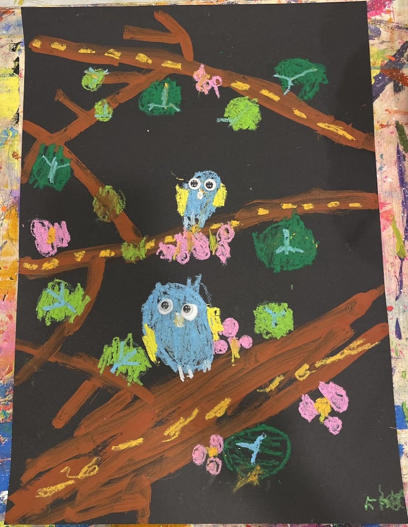 A vibrant child's artwork featuring two blue owls perched on a tree branch with colorful leaves and flowers.