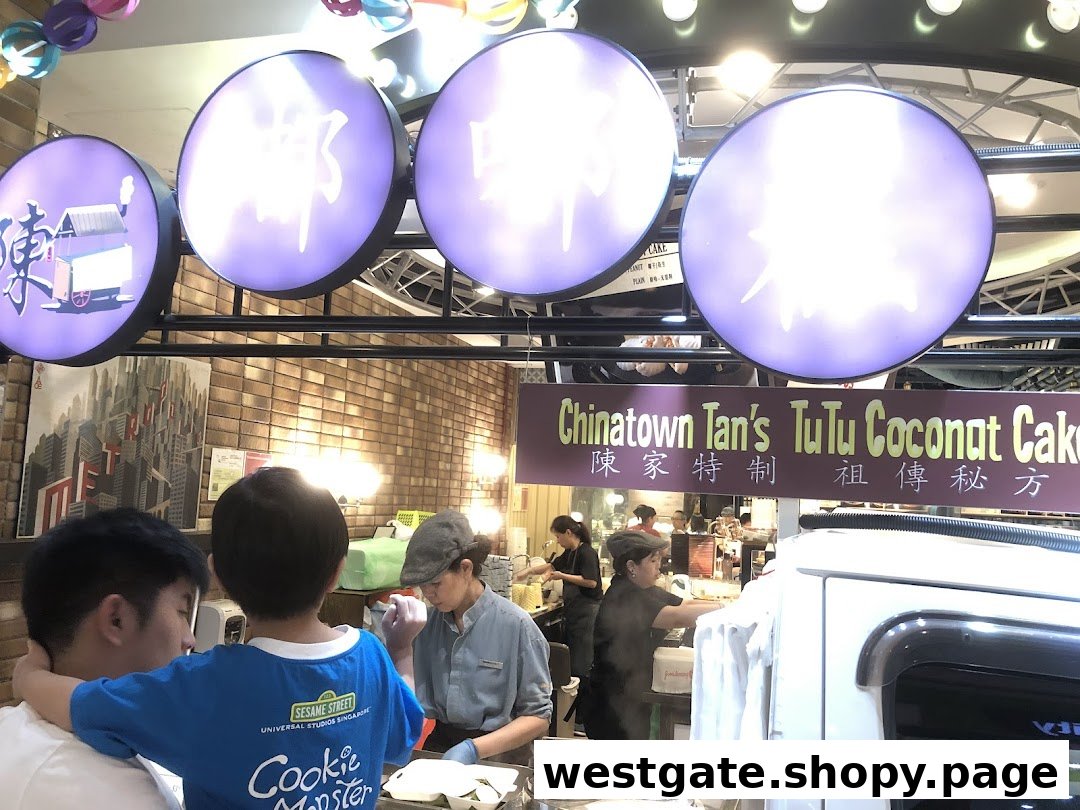 Customers and staff at Chinatown Tan's TuTu Coconut Cake stall, preparing traditional coconut cakes.
