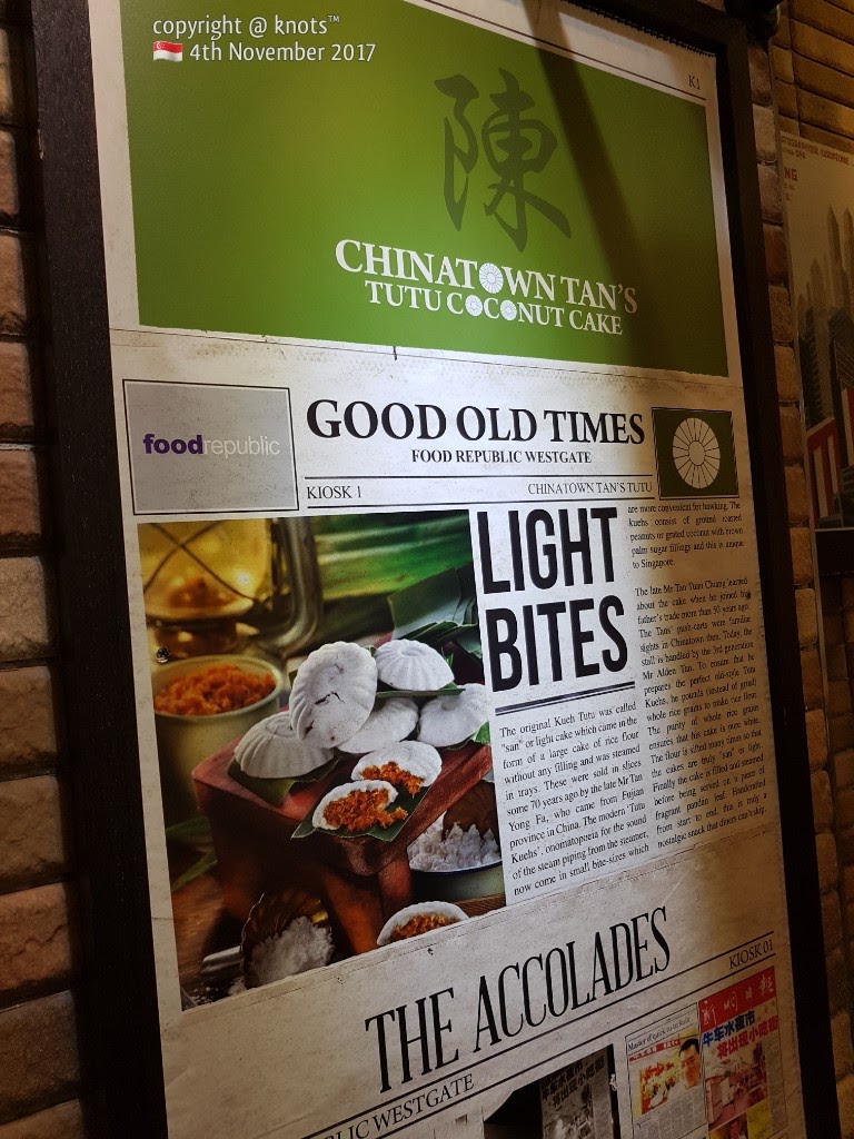 A promotional display for Chinatown Tan's Tutu Coconut Cake, highlighting its history and traditional kueh.