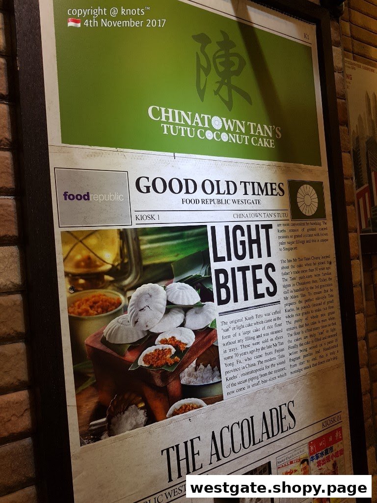A promotional display for Chinatown Tan's Tutu Coconut Cake, highlighting its history and traditional kueh.