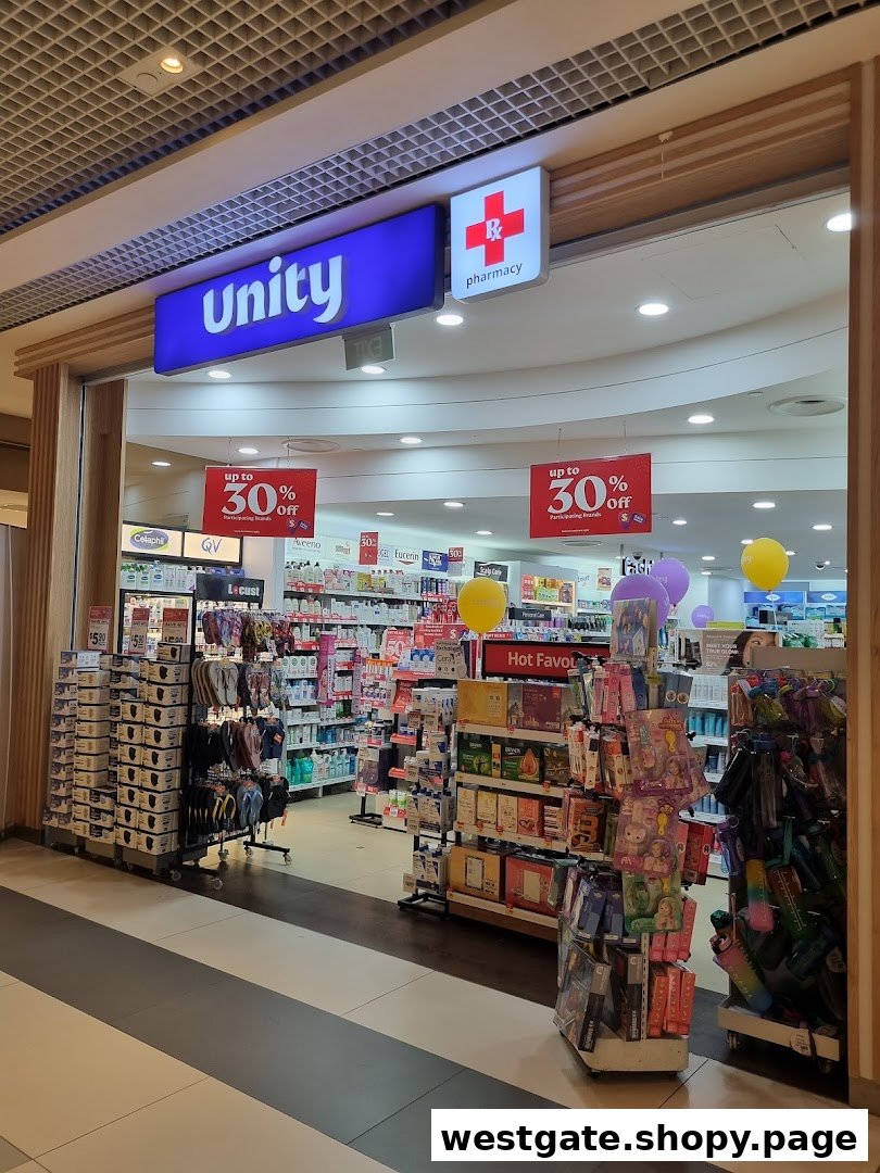 The brightly lit entrance of Unity pharmacy, showcasing health and wellness products with prominent sale signs.
