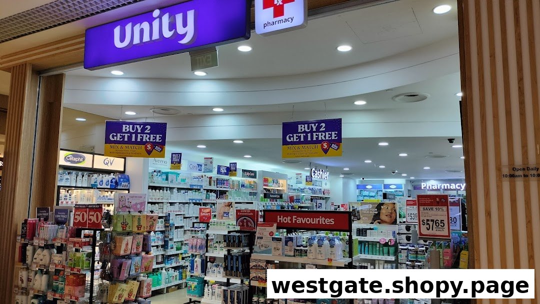 The entrance of Unity Pharmacy, showcasing health and beauty products, promotions, and operating hours.