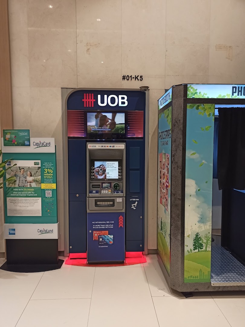 A UOB ATM and a photo booth located at Westgate shopping mall.