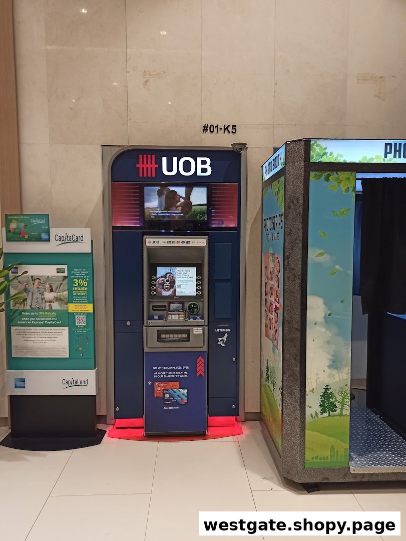 A UOB ATM and a photo booth located at Westgate shopping mall.