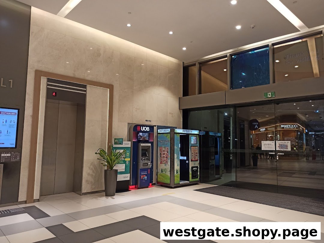 UOB ATM, photobooths, and elevator located near a mall entrance at Westgate.