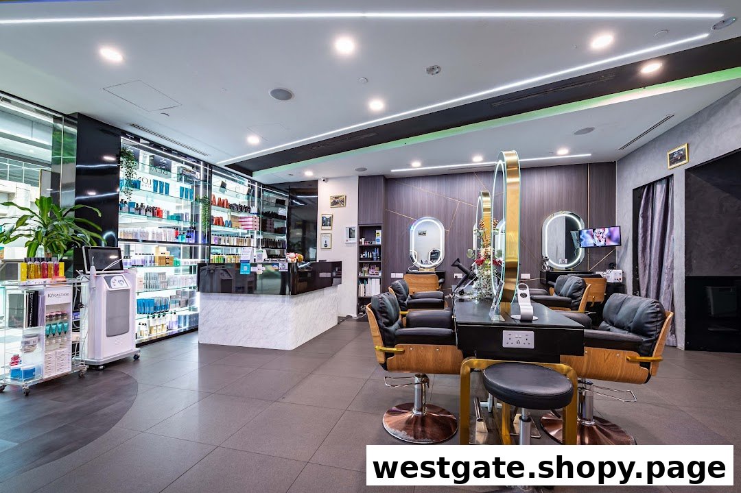 Interior view of a modern hair salon with styling stations, product displays, and a reception counter.