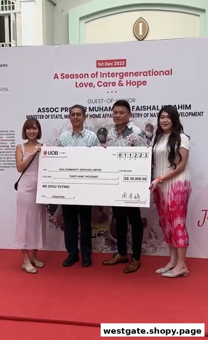 People holding a large donation check for S$39,000 at a community event.
