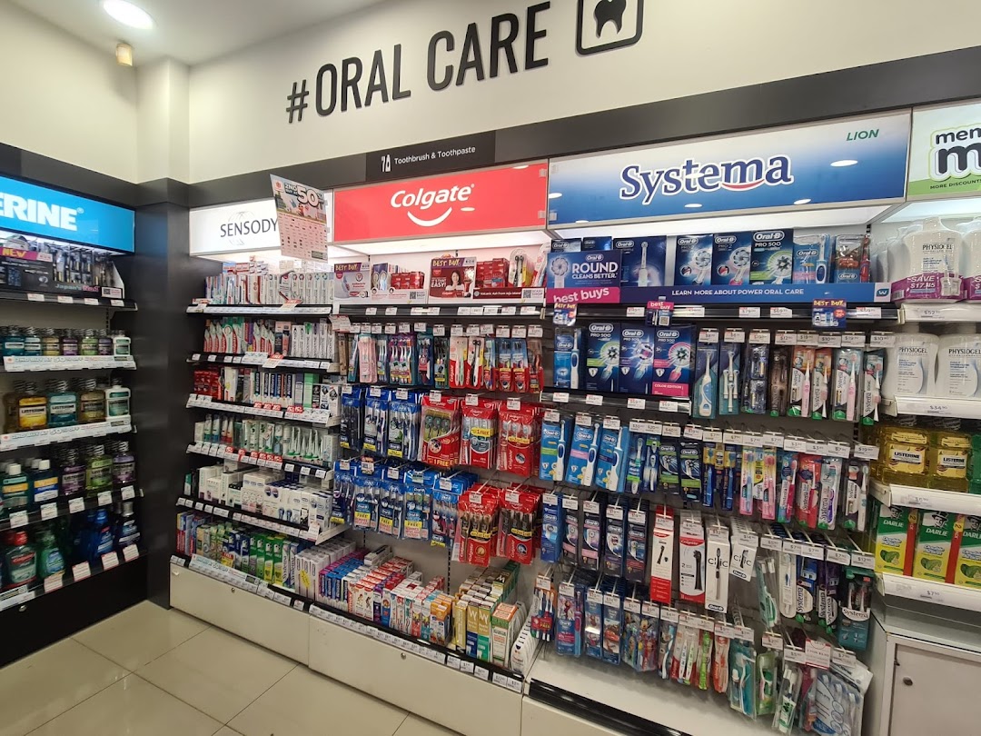 A well-stocked oral care aisle featuring toothbrushes, toothpaste, and mouthwash from various brands.