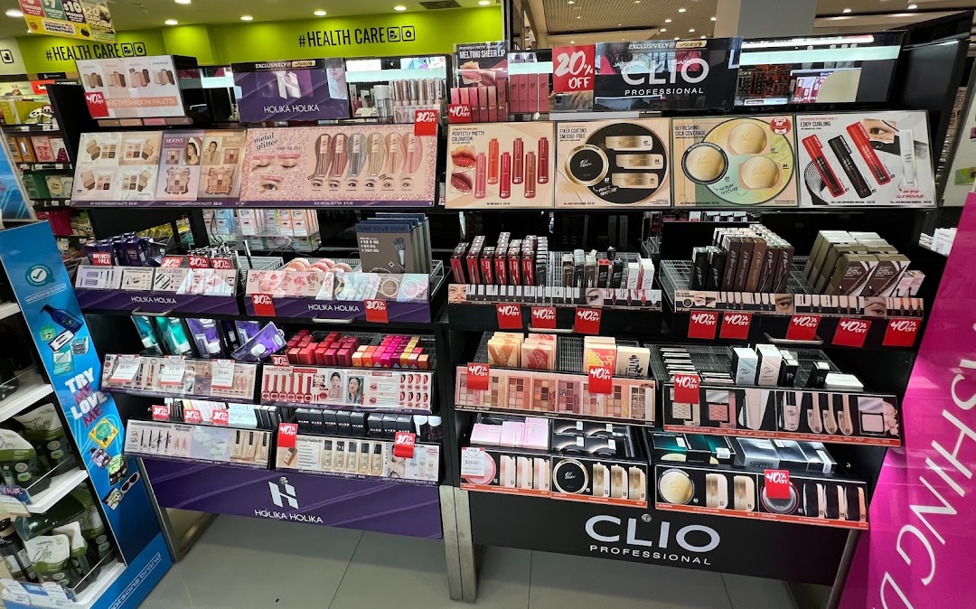 A vibrant display of cosmetics and beauty products from Holika Holika and Clio Professional inside Watsons.