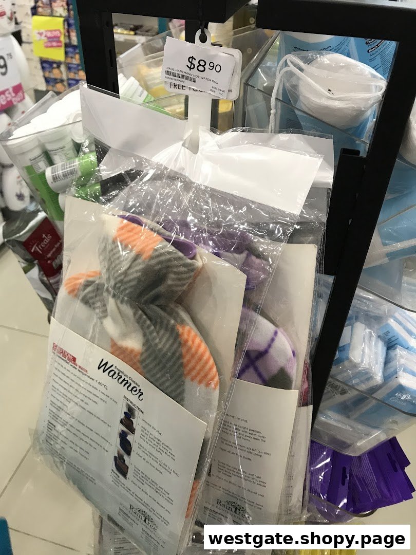 Packaged health and wellness products, including a hot water bag, displayed on a rack inside a Watsons store.