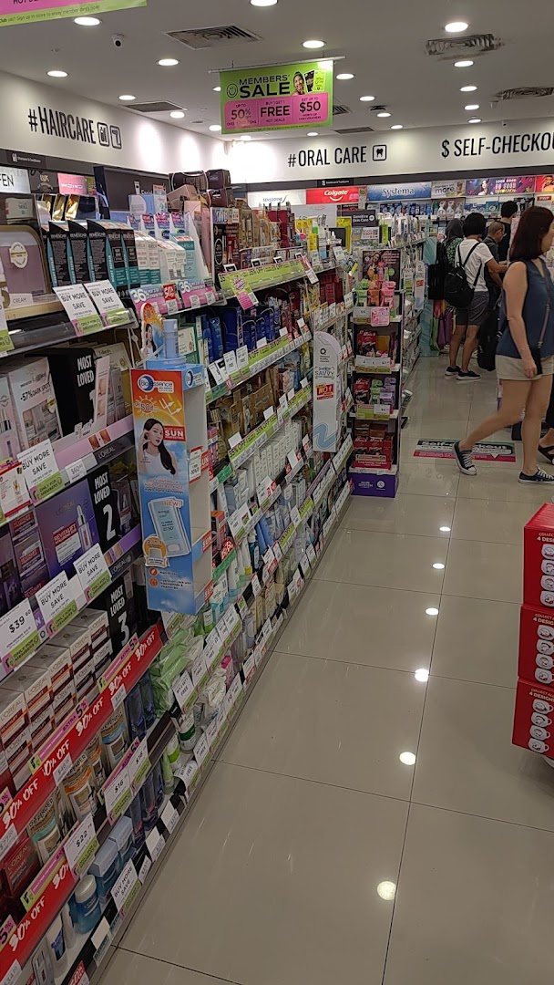 Interior view of a Watsons store aisle showcasing health, beauty, and personal care products.