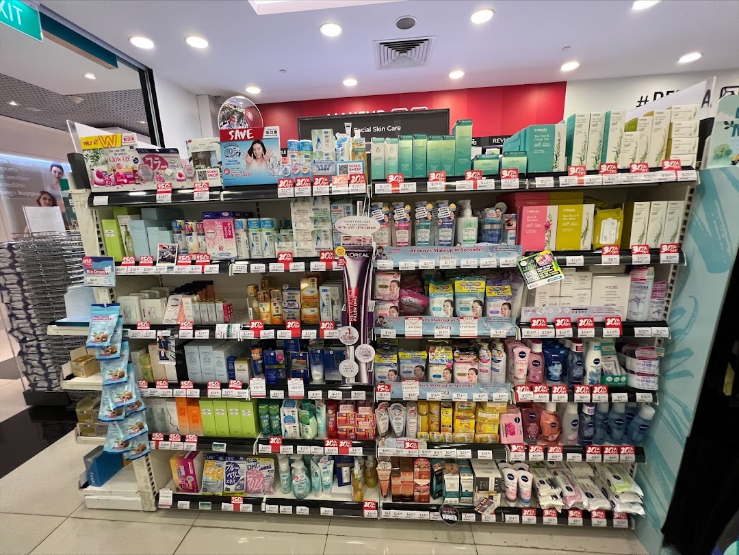Aisle view of Watsons Singapore, showcasing shelves filled with a wide range of skincare and beauty products.