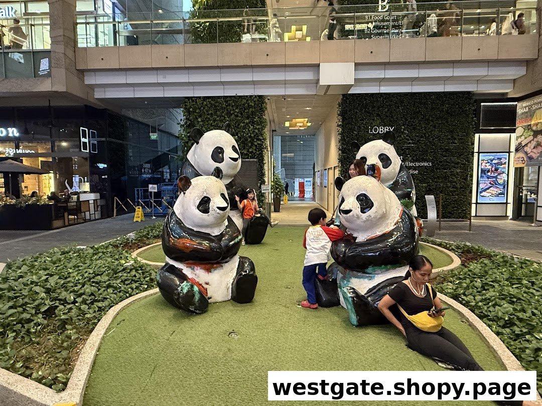 An outdoor mall area featuring large, colorful panda statues, surrounded by greenery and mall visitors.