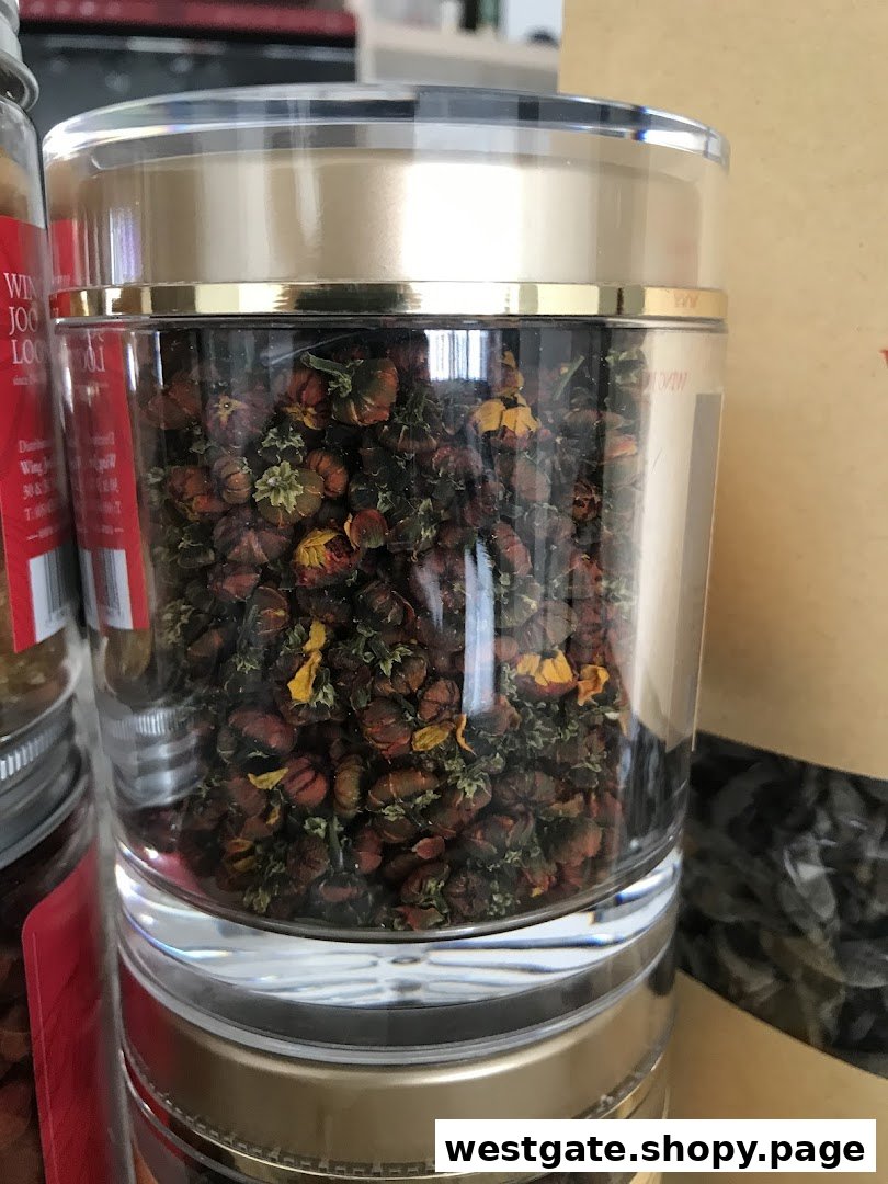 A clear jar filled with dried flower buds, likely for tea or herbal remedies, displayed in a shop.