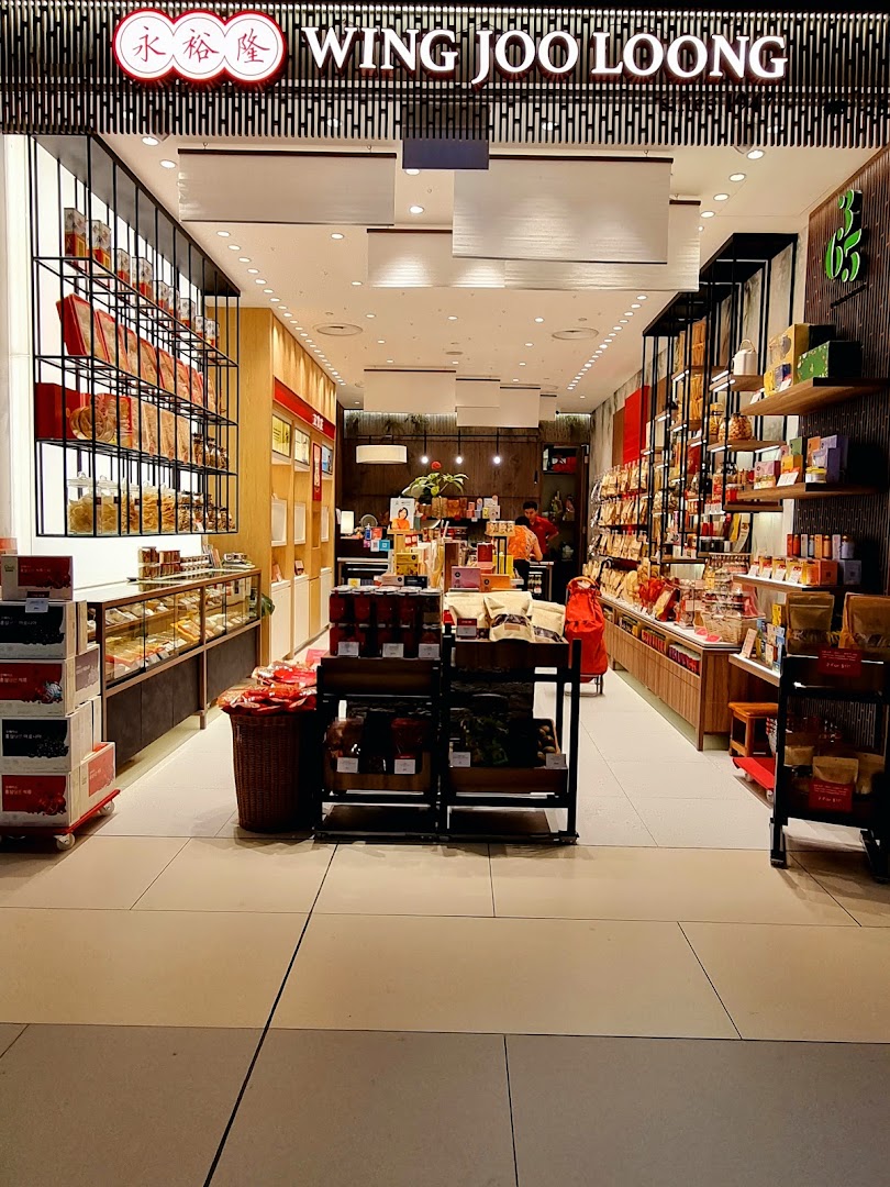 The shop front of WJL 永裕隆, showcasing a wide array of traditional Asian snacks and goods.