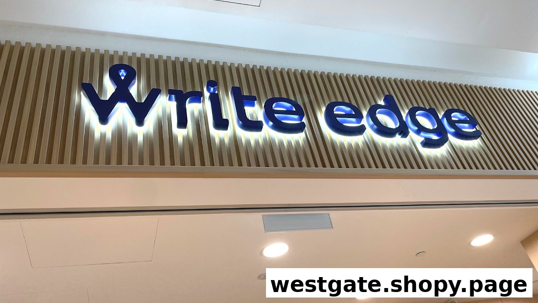 The image displays the illuminated 'Write Edge' shop sign with a wooden slatted background.