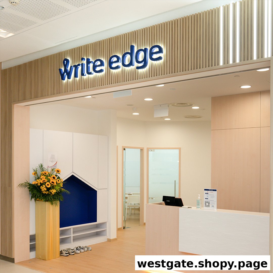 The inviting entrance of Write Edge at Westgate, featuring its prominent logo, reception, and a welcoming waiting area.
