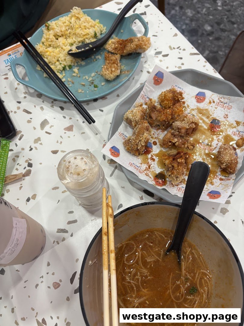 A table laden with delicious Taiwanese dishes, including fried chicken, fried rice, and noodles.