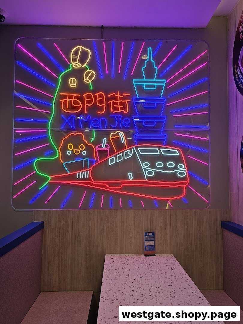 A vibrant neon sign featuring Taiwanese landmarks and a train illuminates a cozy dining booth.