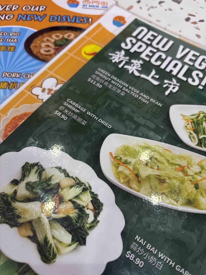 Close-up of Xi Men Jie's menu, highlighting new vegetable specials and other wholesome Taiwanese dishes.