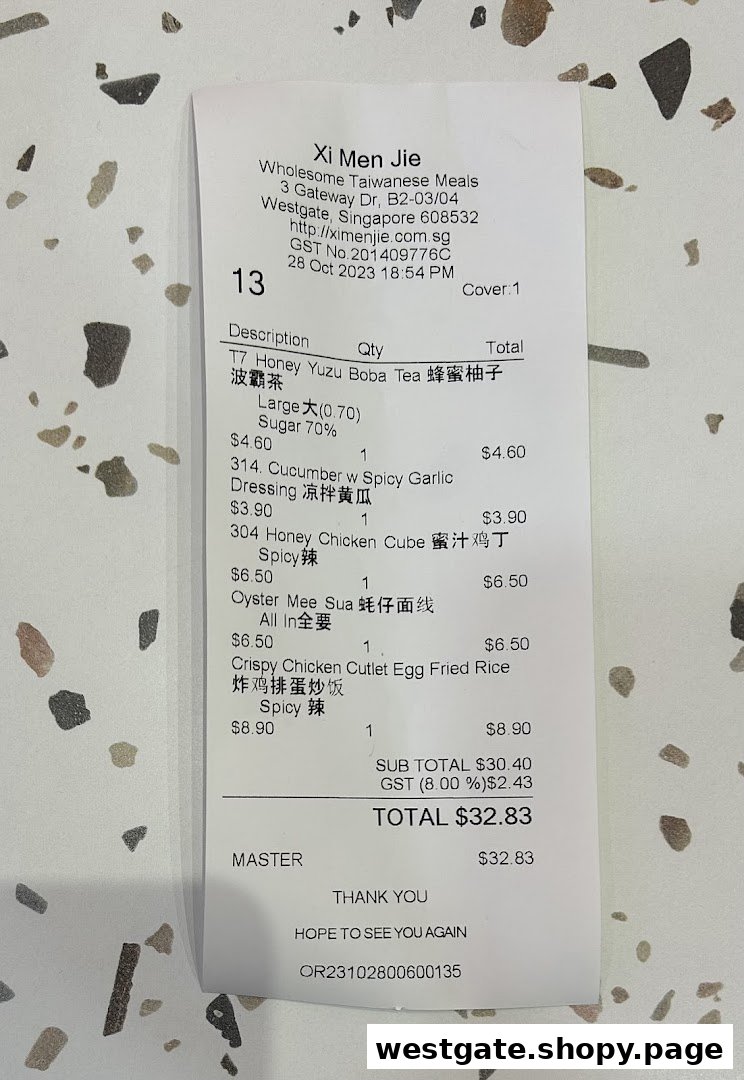A detailed close-up of a receipt from Xi Men Jie, showcasing various Taiwanese meal items and their prices.