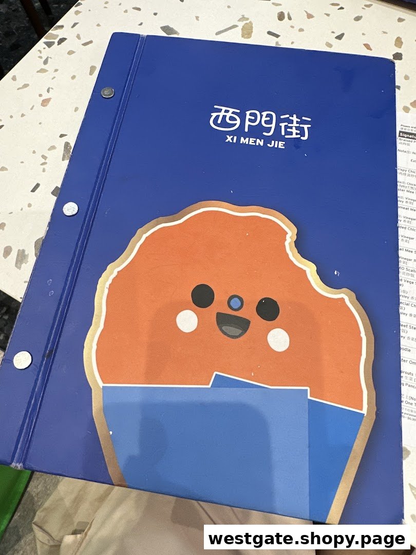 A blue menu binder for Xi Men Jie restaurant featuring a cute cartoon character on its cover.