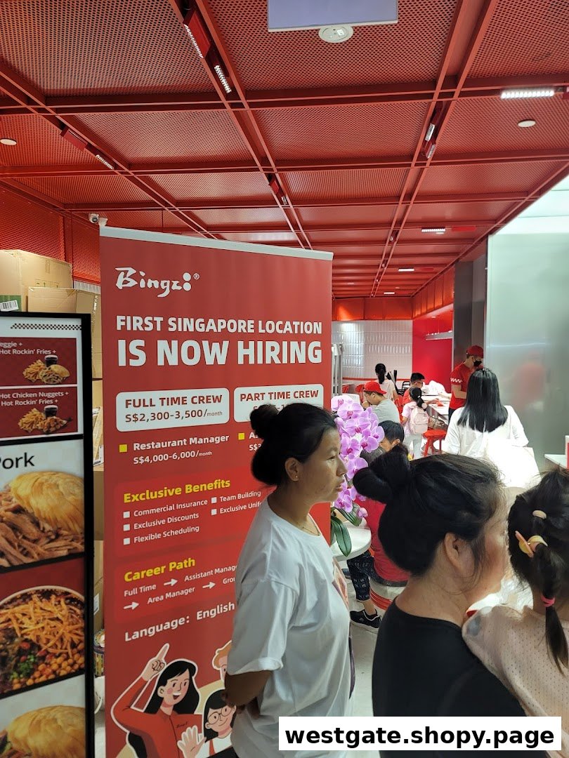 A restaurant interior featuring a prominent "Bingz" hiring banner and customers dining.