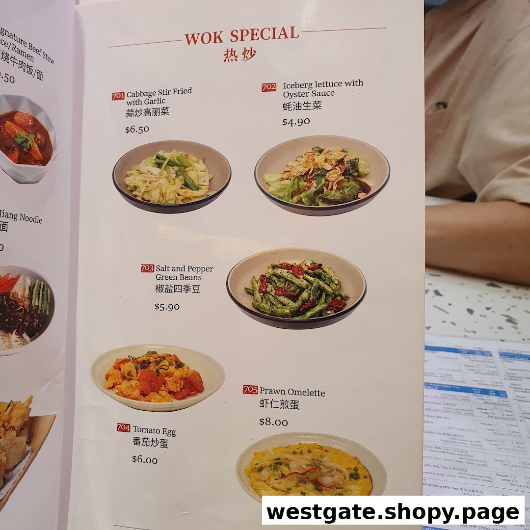 A menu page from Xi Men Jie featuring 'WOK SPECIAL' dishes with photos, names, and prices.