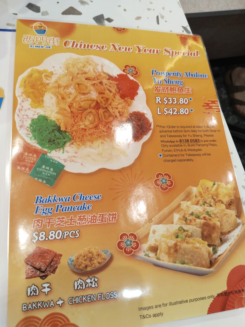 A menu displaying Chinese New Year specials including Prosperity Abalone Yu Sheng and Bakkwa Cheese Egg Pancake.