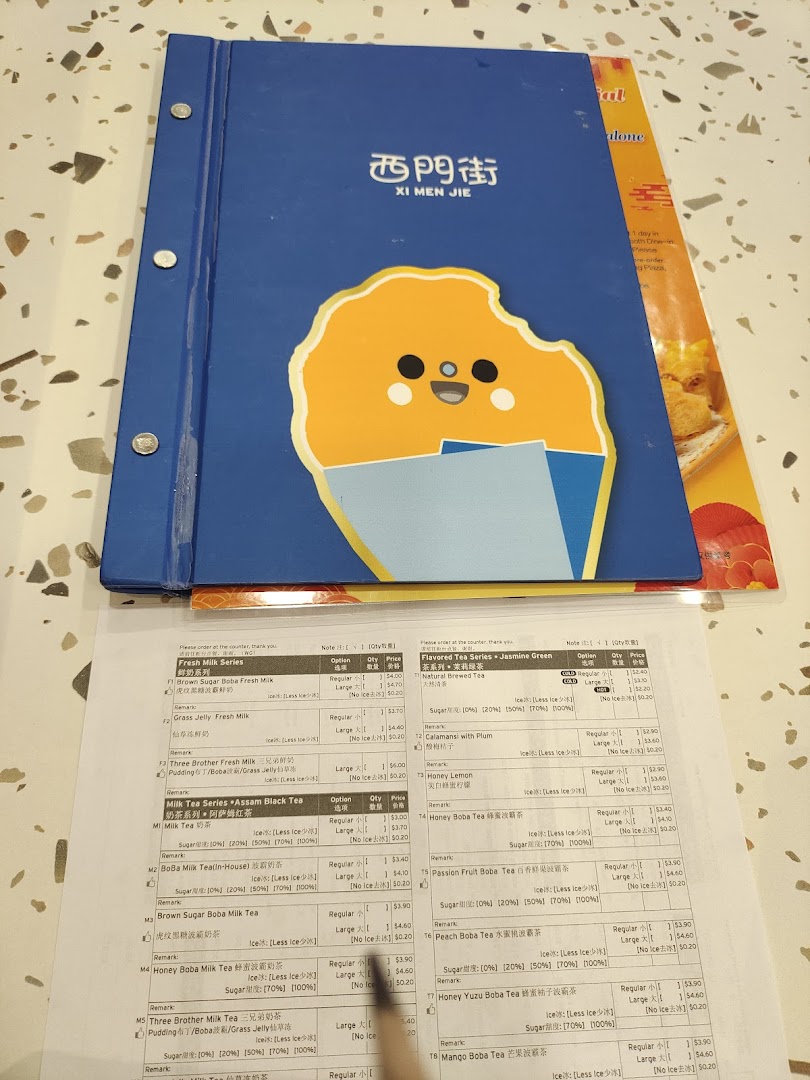 A detailed menu from Xi Men Jie, showcasing a variety of Taiwanese bubble teas and fresh milk drinks.