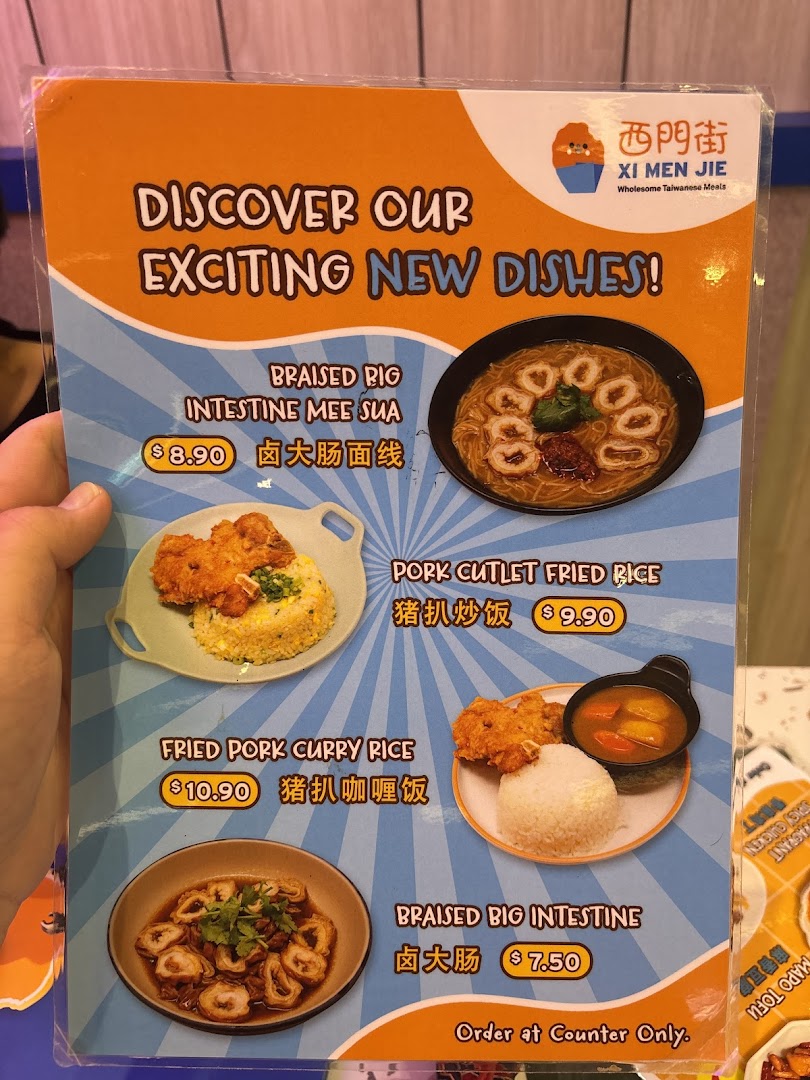 A vibrant menu board showcasing new Taiwanese dishes with images and prices from Xi Men Jie.
