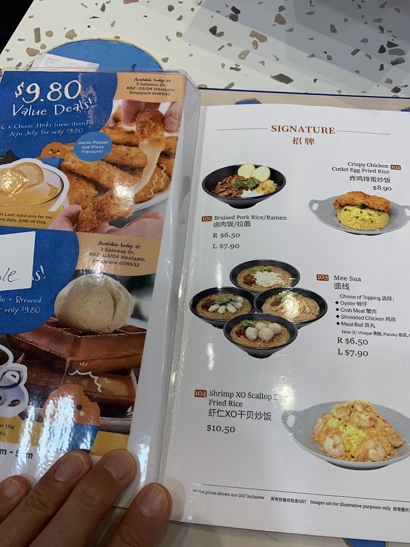 A close-up view of a Taiwanese restaurant's menu, showcasing signature dishes and value deals.
