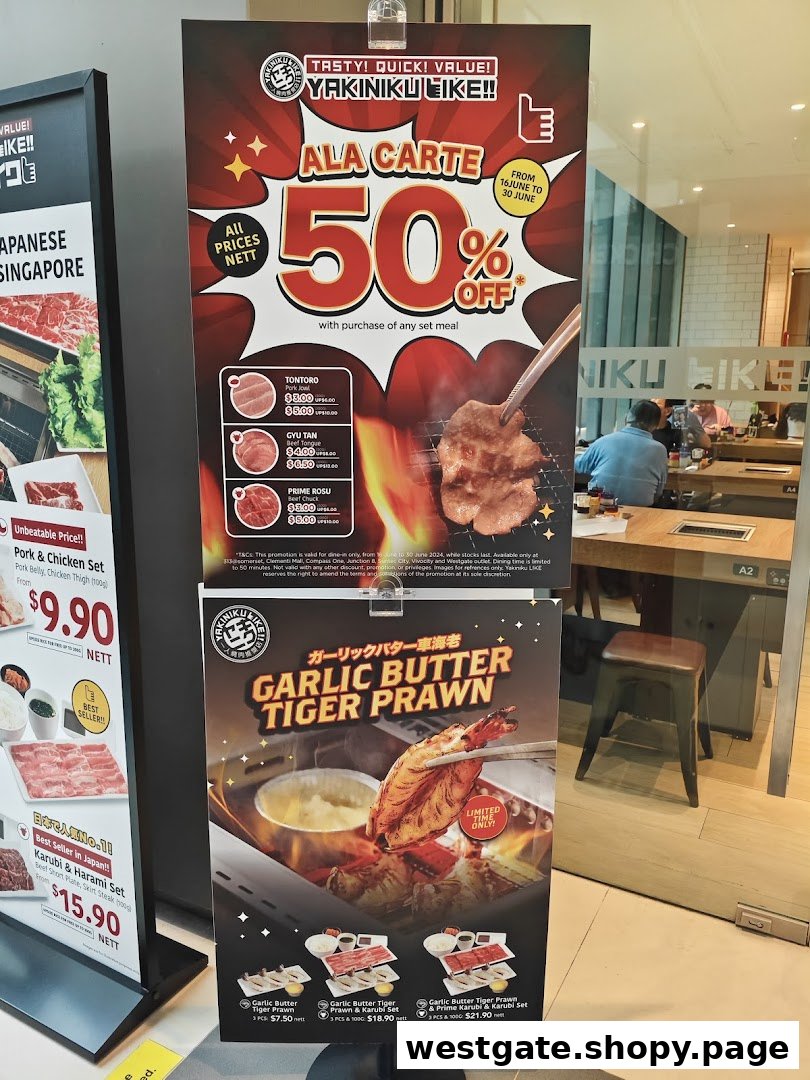 Promotional stands outside Yakiniku Like, showcasing special offers and menu items.