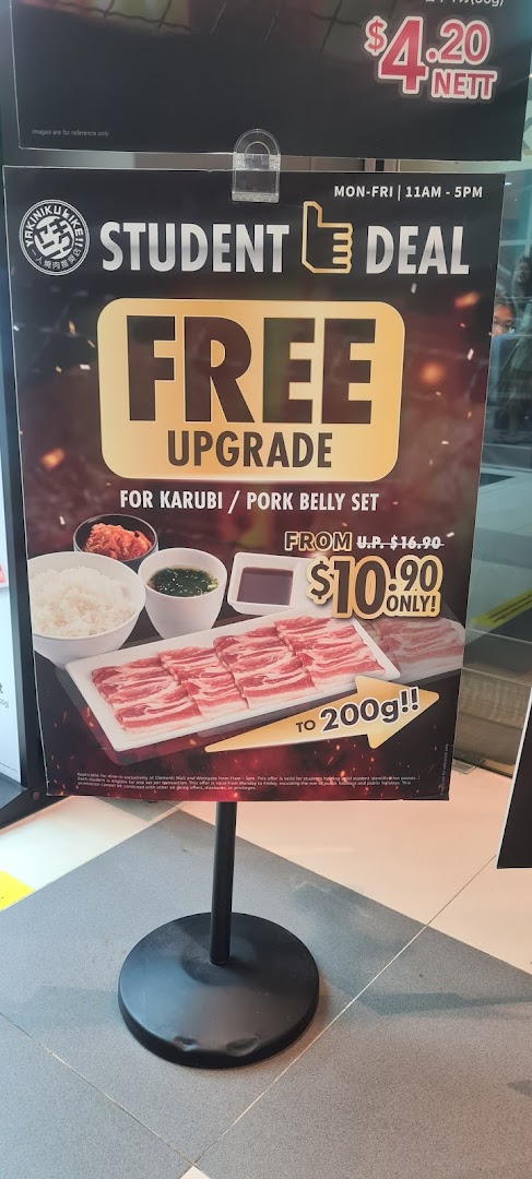A promotional stand advertising Yakiniku Like's student deal for Karubi/Pork Belly sets.