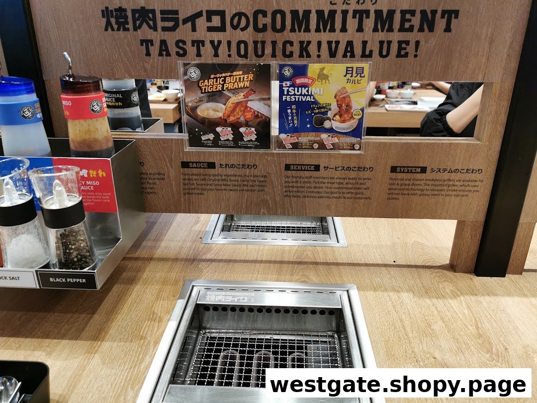 A Yakiniku Like dining station featuring a personal grill, condiments, and promotional posters.