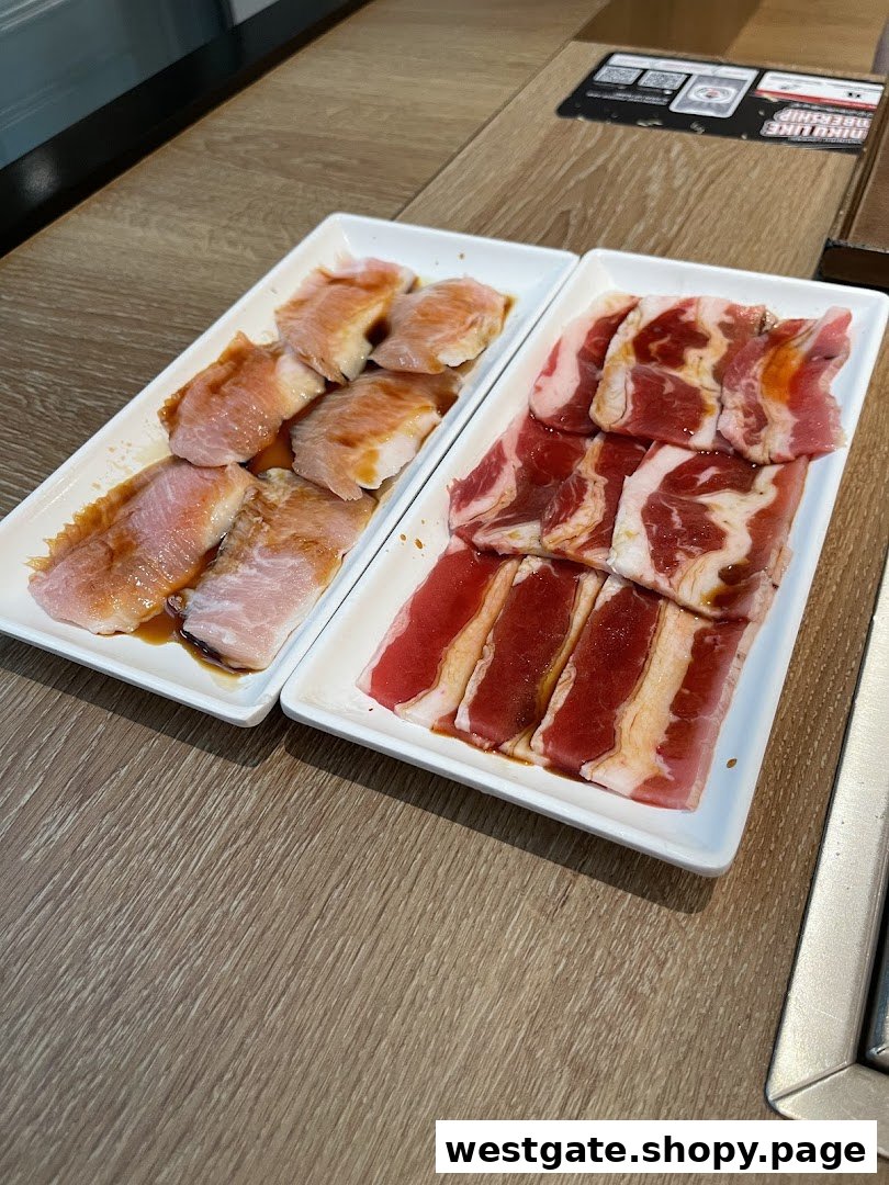 Two plates of raw, marinated meat, likely beef and pork, on a wooden table.