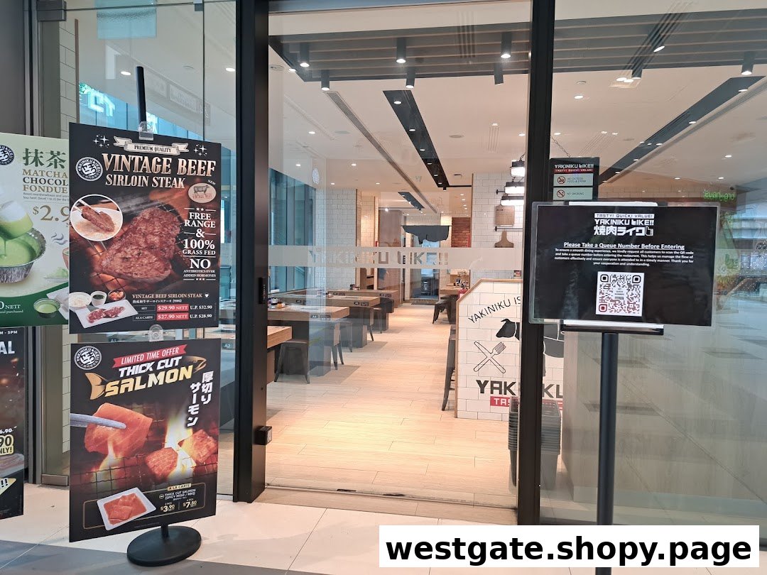 The entrance of Yakiniku Like, featuring promotional posters for vintage beef sirloin and thick-cut salmon.
