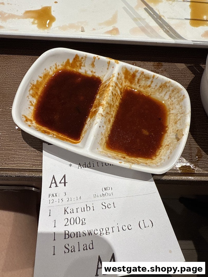 A dipping sauce dish and an order slip showing a Karubi Set and other items at Yakiniku Like.