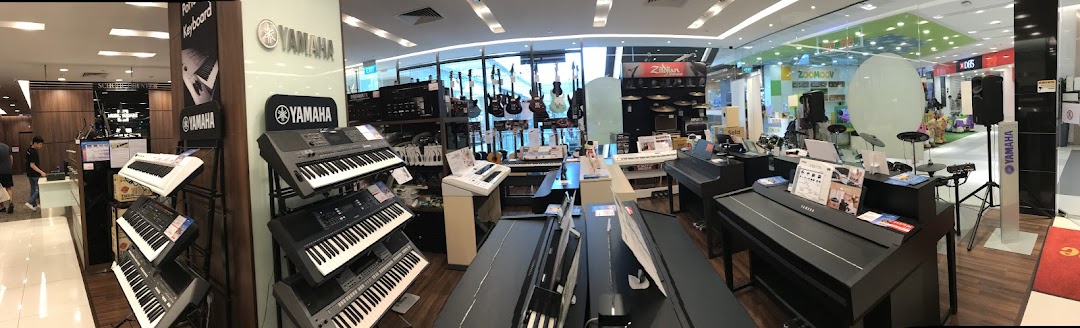 A wide interior view of the Yamaha Music Store, showcasing various musical instruments and equipment.