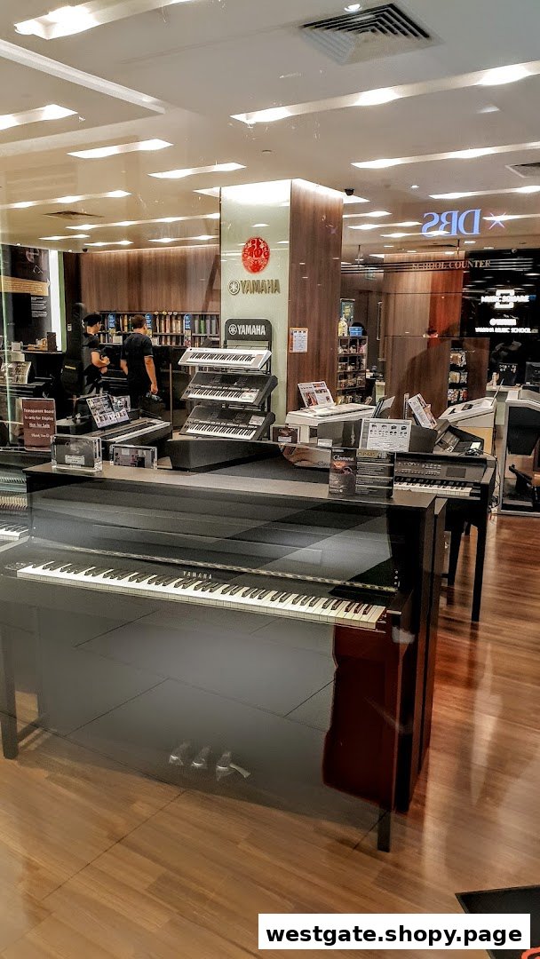 Interior view of Yamaha Music Store, showcasing pianos, keyboards, and staff.