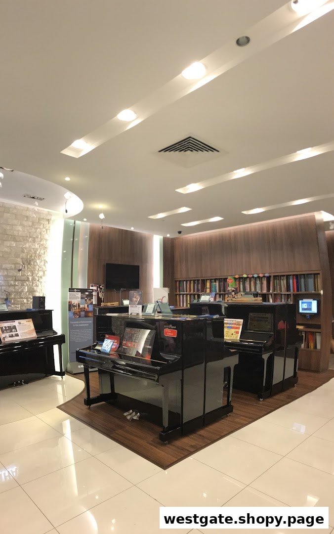 Interior view of a Yamaha Music Store, showcasing pianos, music books, and a welcoming ambiance.