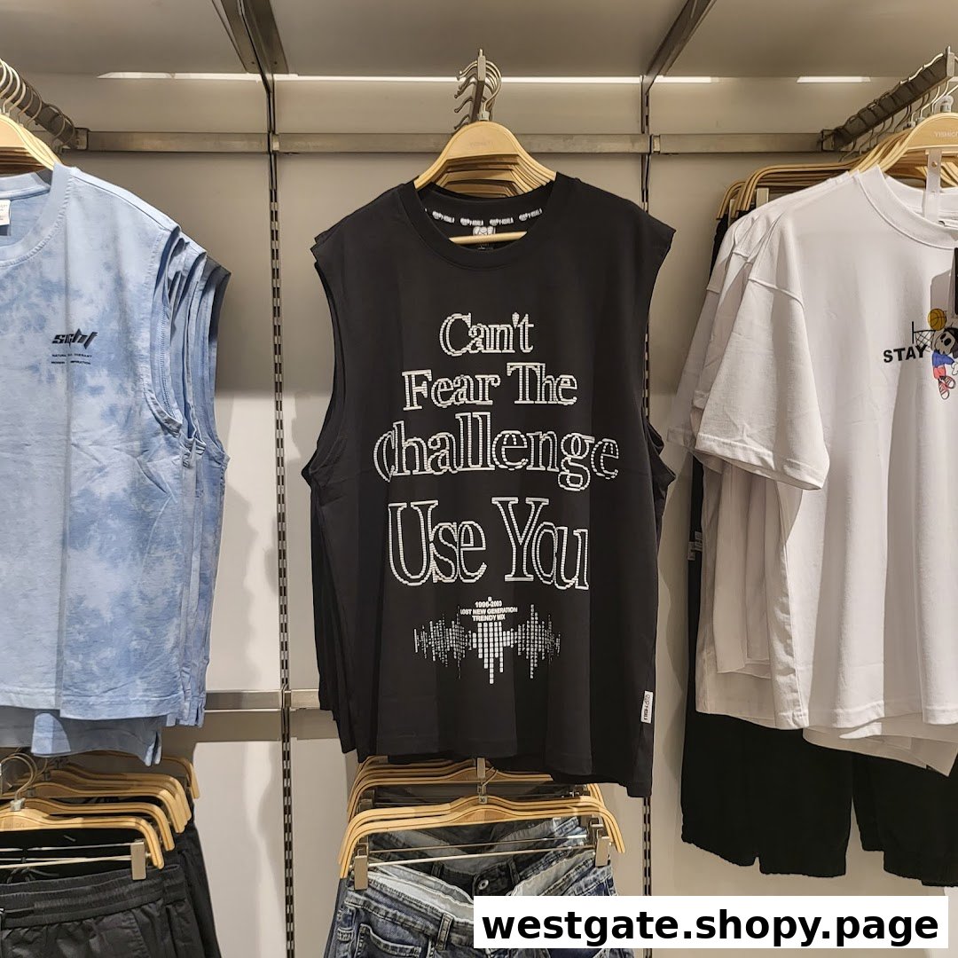A display of trendy casual wear, including a black graphic tank top and blue tie-dye top.