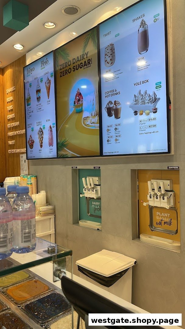 Interior view of Yolé Westgate, showcasing digital menus, self-serve frozen yogurt machines, and topping bar.